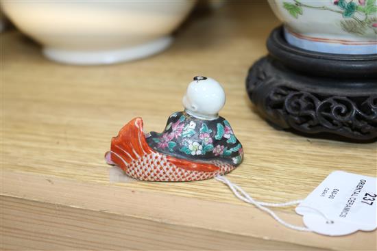 Two Chinese famille rose dishes, a figure of a boy, a porcelain brush pot and a bamboo brush pot tallest 28cm